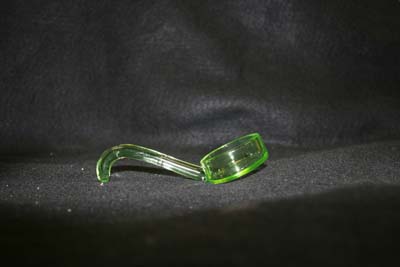 press glass spoon glued