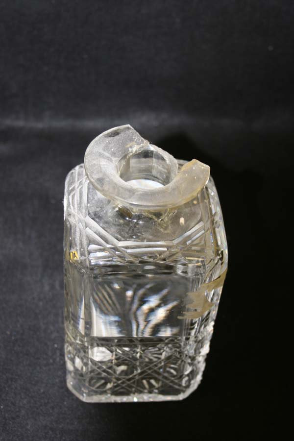 Crystal decanter with a broken neck  and missing pc.