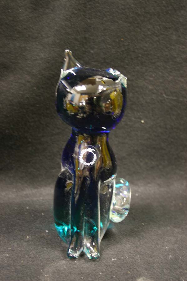 glass cat with one broken ear
