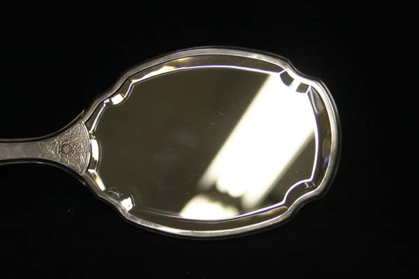 Antique beveled glass hand mirror 