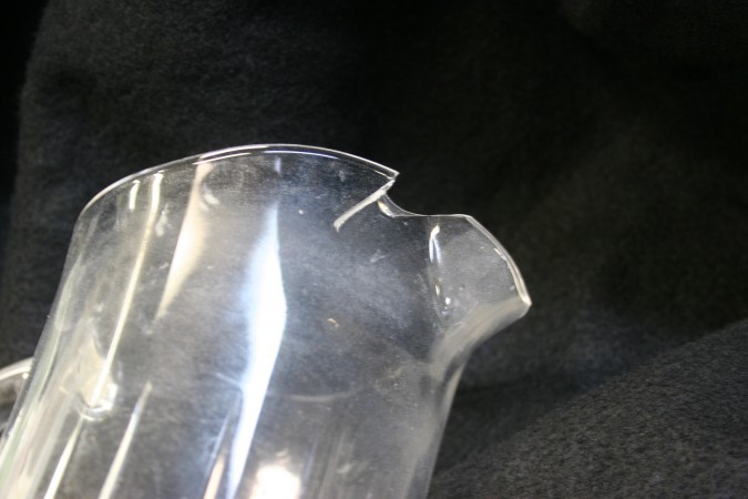 chipped and cracked glass pitcher